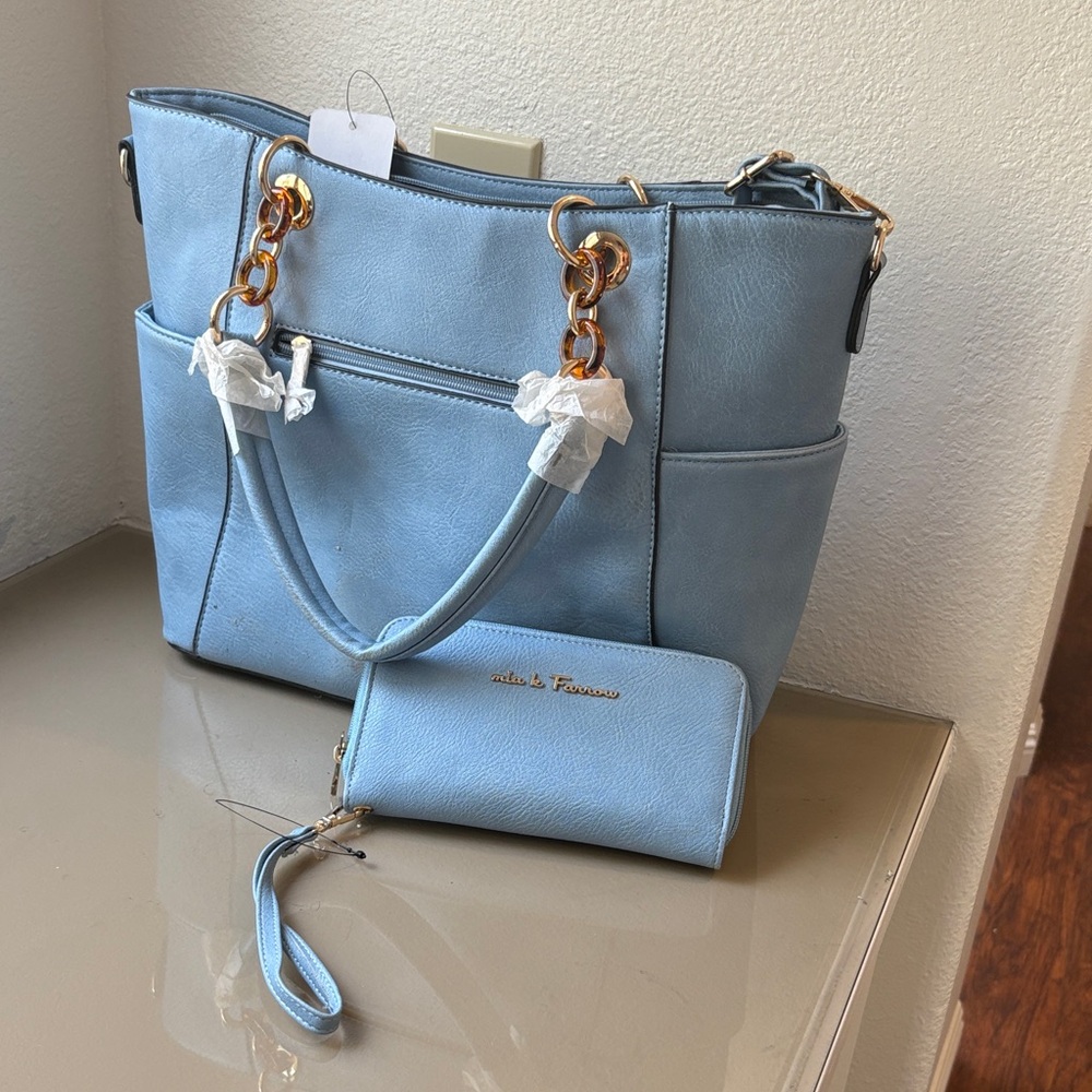 Stylish Light Blue Shoulder Bag with Gold Accents